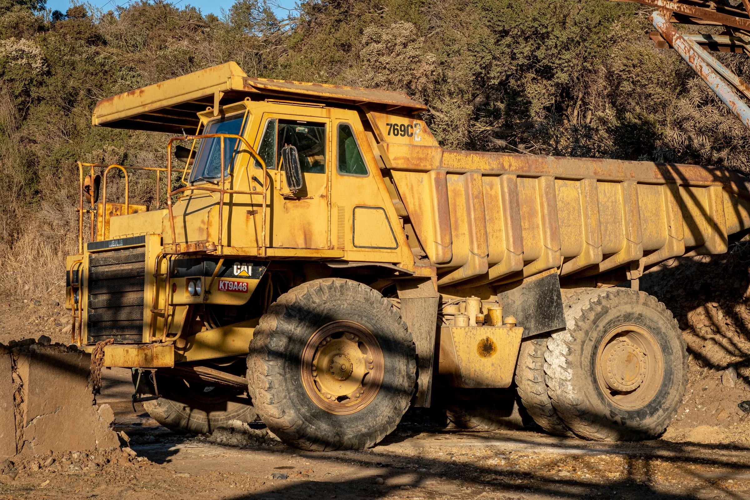 Heavy-duty yellow dump truck on a construction site